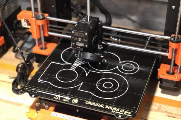 The reliable Prusa i3 workhorse printing the gearbox in a single 4 hour print.