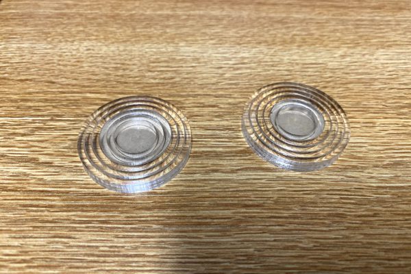 Laser cut, 1/8th inch concentric disks of 15+0.0mm, 20+0.1mm, 25+0.2mm, etc offsets to identify correct offset value for dimensional accuracy.