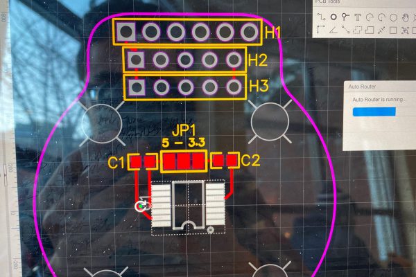 Initial layout minimized total board size and relies heavily on thin traces.